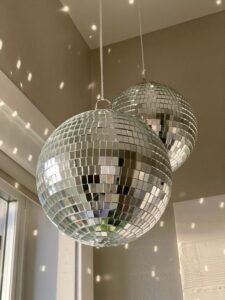 haze's mirror ball hanging from the ceiling